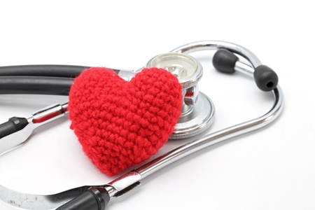 Perspective of Stethoscope and Red Heart on White Background using as Valentine Love Concept (Selective focus on Hearth)の写真素材