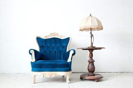 Blue classical style Armchair sofa couch in vintage room with desk lampの写真素材