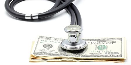 Stethoscope on Money Dollar Cash Currency Banknote Background Using for Healthy Financial and Insurance Conceptの写真素材