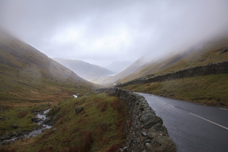 Empty countryside road in at lake district with rain, UKの写真素材