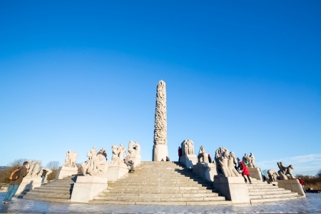 OSLO NORWAY- JANUARY 1: Visitors enjoying the statues created by Gustav Vigeland in the popular Vigeland park in Oslo, Norway on January 1, 2013.のeditorial素材