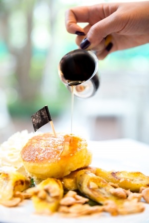 Coconut pancake with honey syrupの写真素材