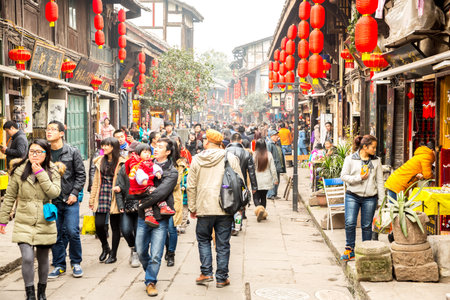 CHONGQING, CHINA - JAN 17: Unidentified tourists are shopping at Ciqikou Ancient Town on January ...