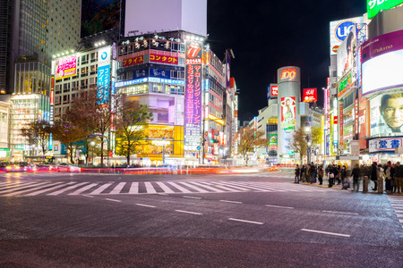 TOKYO - DECEMBER 10: Pedestrians cross at Shibuya Crossing on December 10, 2013 in Tokyo, Japan. The crosswalk is one of the world's most famous implementations of a scramble crosswalk.のeditorial素材