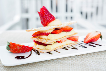 Strawberry Mille Feuille cake in white plateの写真素材