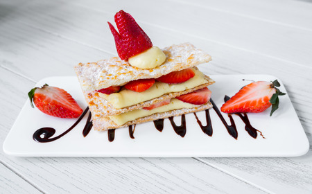 Strawberry Mille Feuille cake in white plateの写真素材