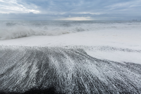 The black sand beach of Reynisfjara Dyrholaey promontory in the southern coast of Iceland.の写真素材