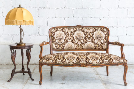 Brown Classical style sofa couch in vintage room with desk lamp