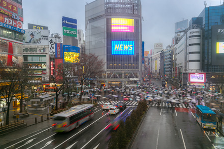 TOKYO - FEB 18: Pedestrians cross at Shibuya Crossing on Febuary 18, 2015 in Tokyo, Japan. The crosswalk is one of the world's most famous implementations of a scramble crosswalk.のeditorial素材