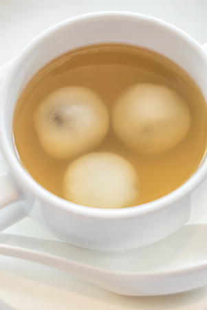 Sticky rice pearls stuff with blacksesame in ginger soupの写真素材