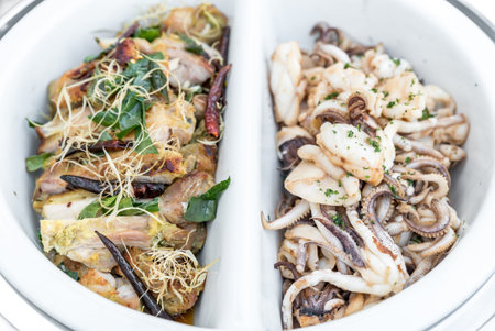 Grilled squid and chicken in buffet line