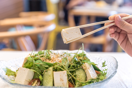 Tofu Salad with Arugula and onsen eggの写真素材