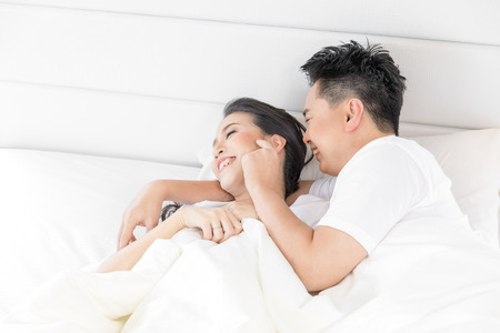 Young loving couple in the bed. Modern lifestyle conceptのeditorial素材