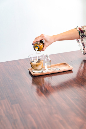 Coffee Cube Latte served with coffe ice cube and milk.の写真素材
