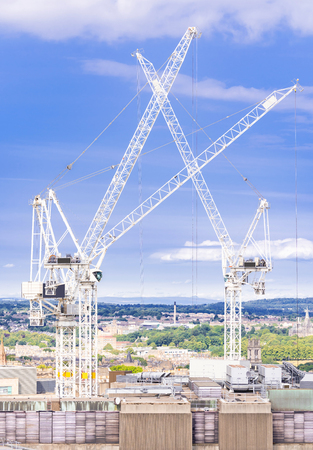 Construction crane working in construction siteの写真素材