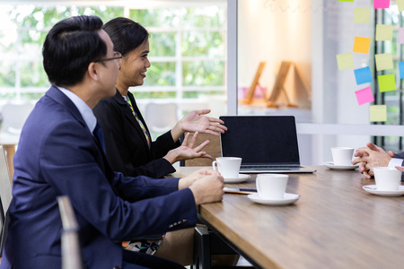 Business people having a conversation in the cafe on coffee timeの写真素材