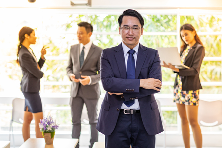 Portrait of Businessman with business team in  using for corporate  workの写真素材