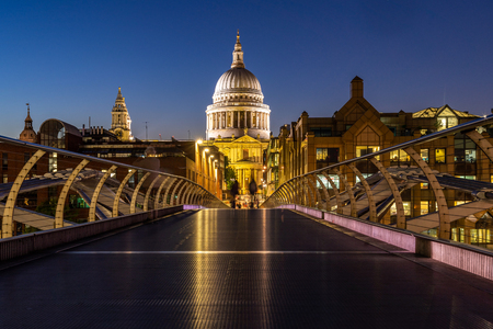 St paul cathedral with millennium bridge sunset twilight in London UK.の写真素材
