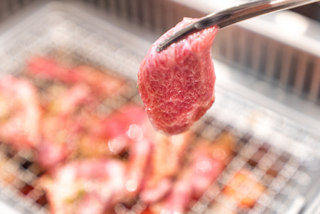 Grilled japanese wagyu premium beef yakiniku with red hot charcoalの写真素材