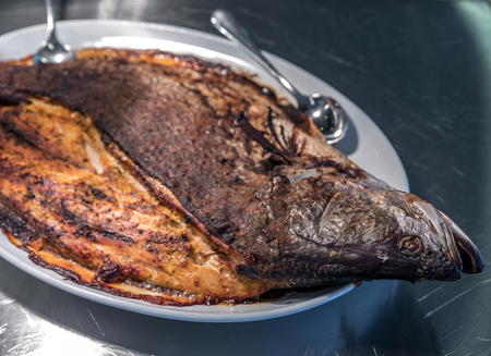 Groumet whole salmon baked with spice and herb thai styleの写真素材