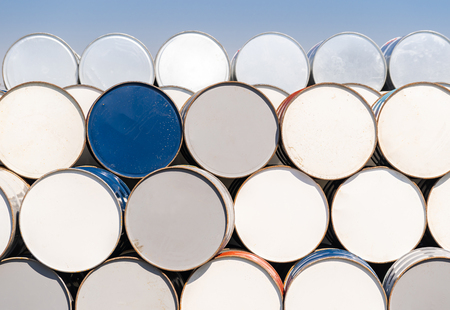 Industry oil chemical metal barrels stacked up in waste yard of tank and containerの写真素材