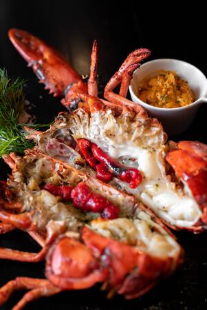 Grilled boston lobster serve with butter chilli sauce with lemon and salt.の写真素材