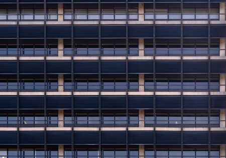 Urban abstract - window facade of business center office building with reflections and colours. Philadelphia PA USAの写真素材