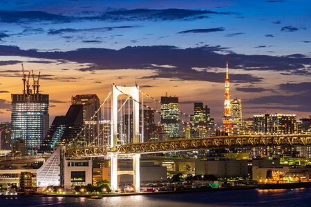 Aerial view of Tokyo skylines with Rainbow bridge and tokyo tower over Tokyo bay Sunset Twilight from Odaiba in Tokyo city Kanto Japan.の写真素材