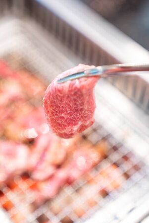 grilled japanese wagyu premium beef yakiniku with red hot charcoalの写真素材