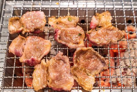 grilled japanese wagyu premium beef yakiniku with red hot charcoalの写真素材