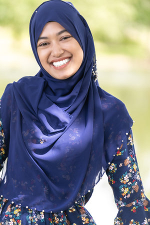 Portrait of good-looking Happy young teenager Muslim islamic asian university girlの写真素材