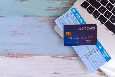 Online planning for Vacation with green wooden backgroundの写真素材