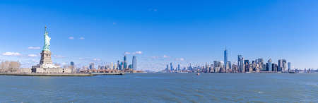 Panoramic landscape of Statue of Liberty with Manhattan downtown Skylines skyscraper building in background, NYC, New York State USA. New York Landmark Travel Destination and cityscape concept.のeditorial素材