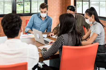 Group of asian and caucasian business person team meeting and brainstorm in meeting room after...