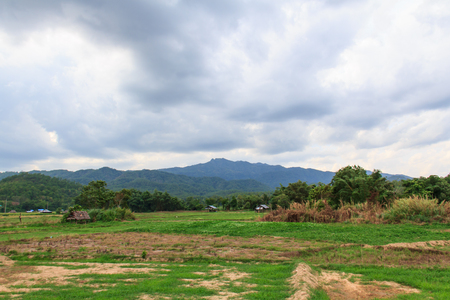 Fields, mountains, cloudsの写真素材