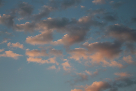 Blue sky and red cloudsの写真素材