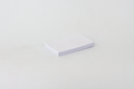 White business card on a white background.の写真素材