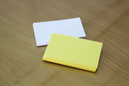 White and yellow card on the desk.の写真素材