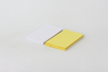 Yellow card on a white background.の写真素材