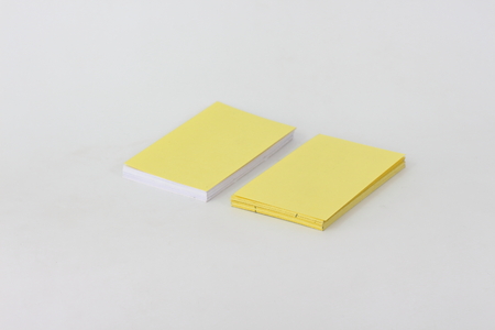 Yellow card on a white background.の写真素材