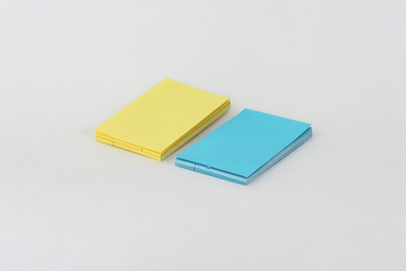 Business cards, yellow and blue on a white background.の写真素材