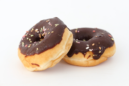 Candy, chocolate donuts on a white background.の写真素材