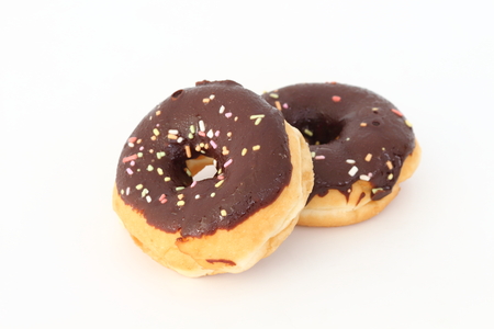 Candy, chocolate donuts on a white background.の写真素材