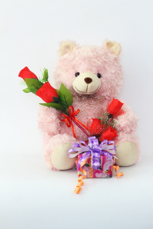 Teddy bears, pink and red roses and gift box on a white background.の写真素材