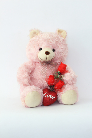Teddy bears, pink and red roses on a white background.の写真素材