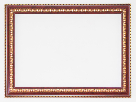 Brown wooden frame with gold edges on white background.の写真素材