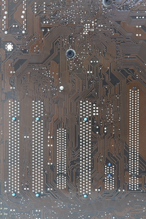 Computer circuit board brown pattern on a white backgroundの写真素材
