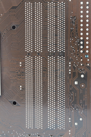 Computer circuit board brown pattern on a white backgroundの写真素材