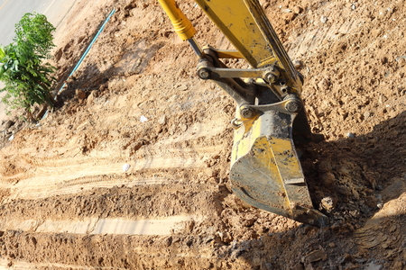 Makro is adjusting the soil to make the road.の写真素材