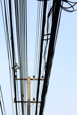 Power poles and many telephone lines in the communication era without borders.の写真素材